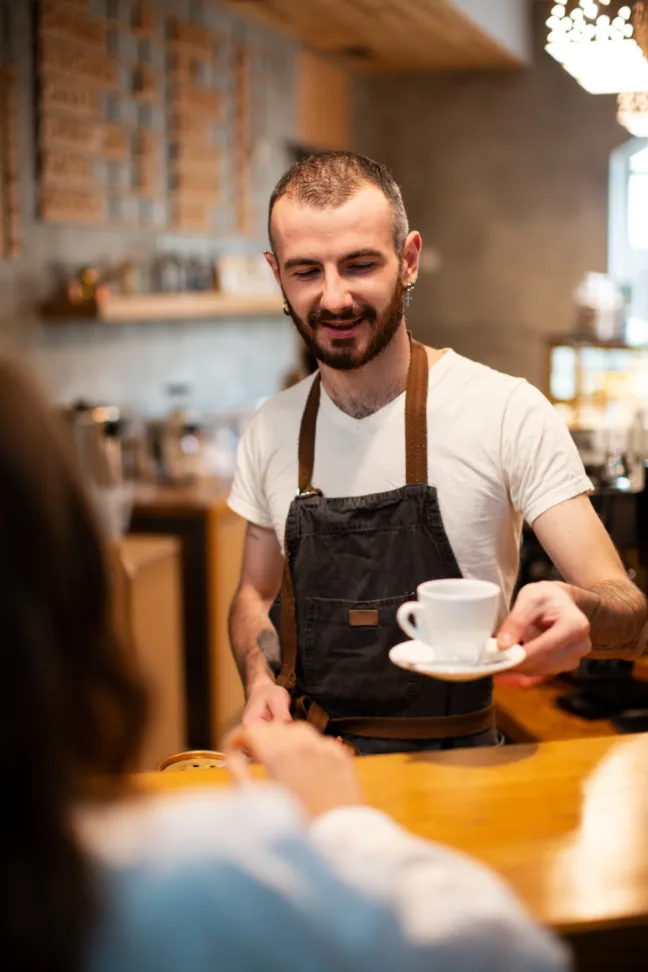 Man in coffee shop - customer service training in Brighton & Hove